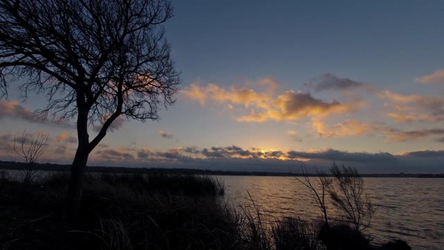 Breaking Sunrise Over a Lake