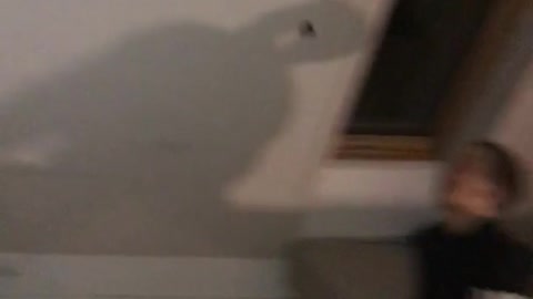 Guy kicks white toy friend catches with mouth