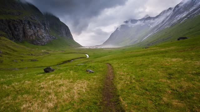 Foundational shot of the valley leading to the same horse beach in Lofoten, Norway