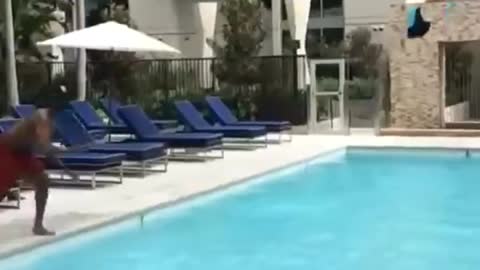 Jump into the pool and throw the camera relay