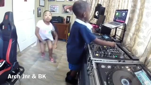 A boy and girl dancing afro music in the studio