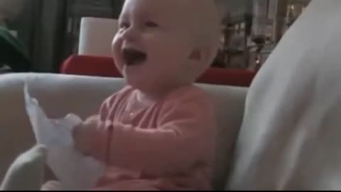 Adorable Baby hysterically laughs in front of the TV