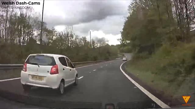 Bad driver. Woman has no lane discipline. UNITED KINGDOM — 2021.05.05