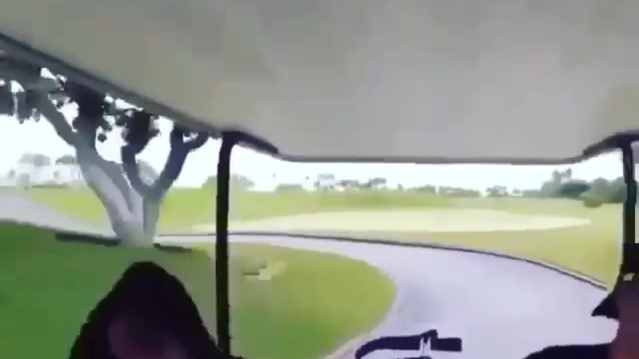 chick in golf car falls out going round a corner at full speed.