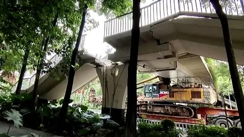 Footbridge collapses after being crashed into by truck in southern China