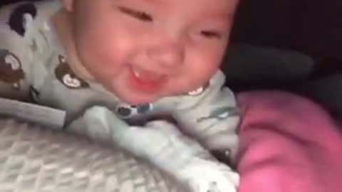 Silly cute baby laughs at fingers