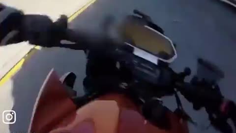 Biker Falls Under Semi