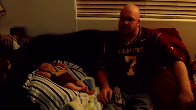 Dad & Baby Share Football Fandom