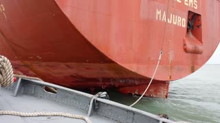 Great Lakes Tug Massachusetts guides freighter Federal EMS down the Calumet Rivere