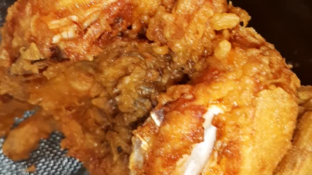 Fried chickens are getting ready to be carried out in Korean traditional market