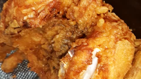 Fried chickens are getting ready to be carried out in Korean traditional market