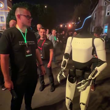 Tesla Optimus Robot Talking with a Human