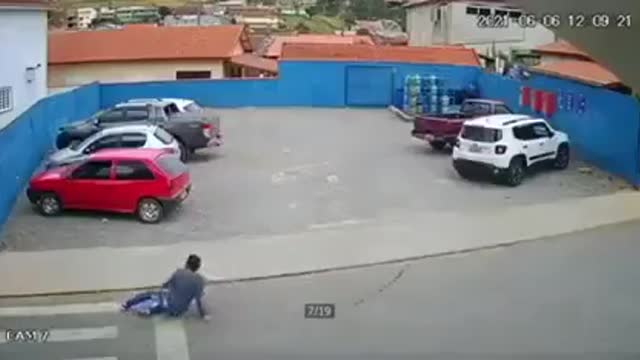 a man dodged a car but hit by a dog