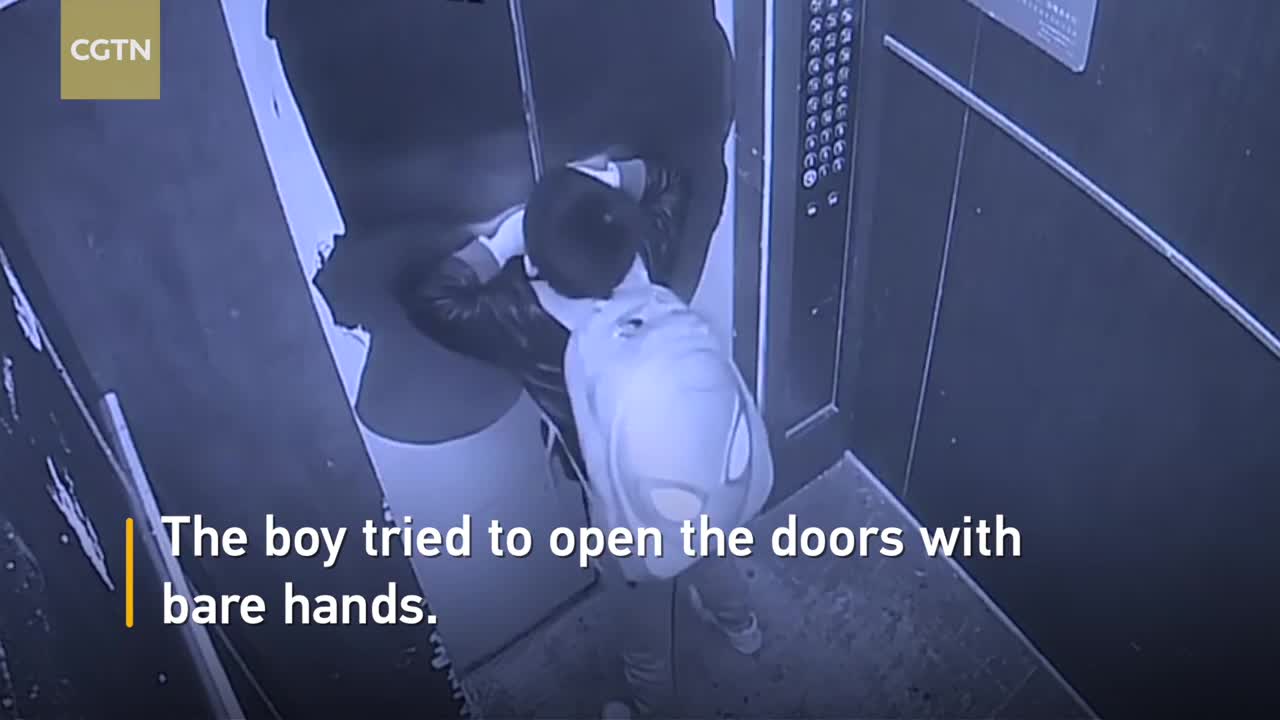 Boy uses umbrella to prevent elevator door from closing, causes free fall