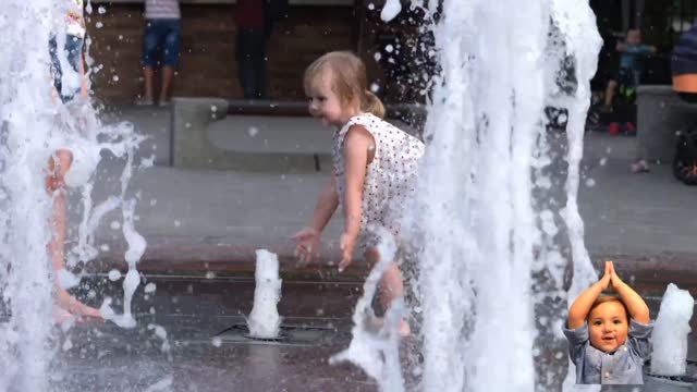 Amazing, A Little girl Catching a Fountain.