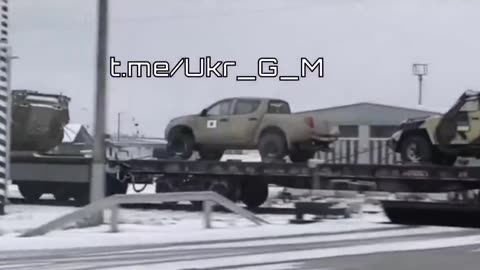 A whole train of captured NATO vehicles is going somewhere in Russia.