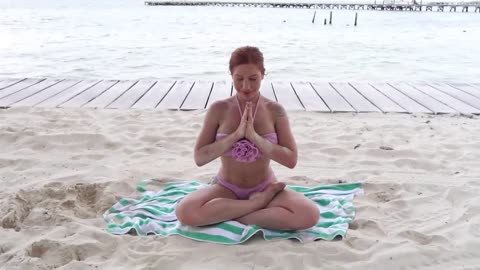 Gymnastics yoga on the beach