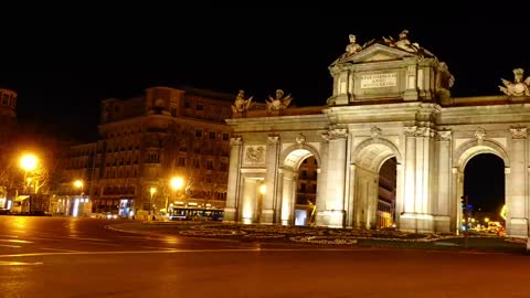 Traffic at Puerta de Alcala at night