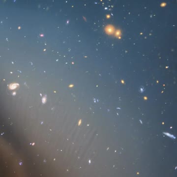 Infinite space covered in stars and galaxies with gradient colors