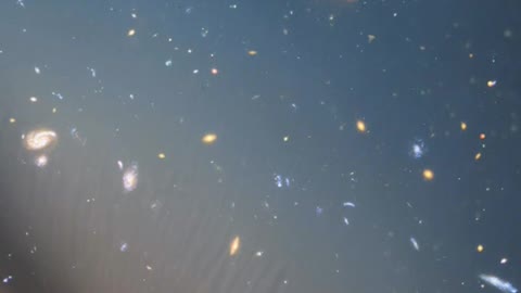 Infinite space covered in stars and galaxies with gradient colors