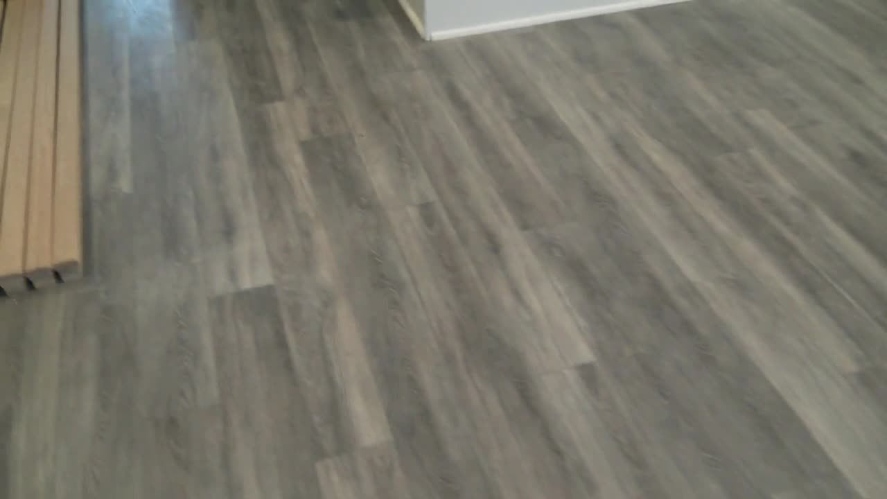 1789 ft of Adura Rigid RPP051 and 173 yds of a plush grey carpet