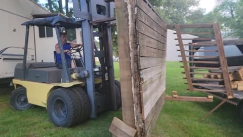 UNLOADING AND DISCARDING: BACKYARD FORKLIFT ACTION