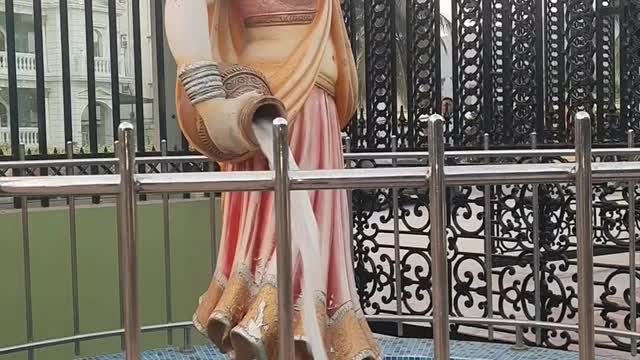 Water coming out of a women statue