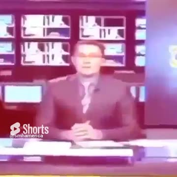 Caught Him Slipping_ News Anchor Caught with his Hand under the Desk