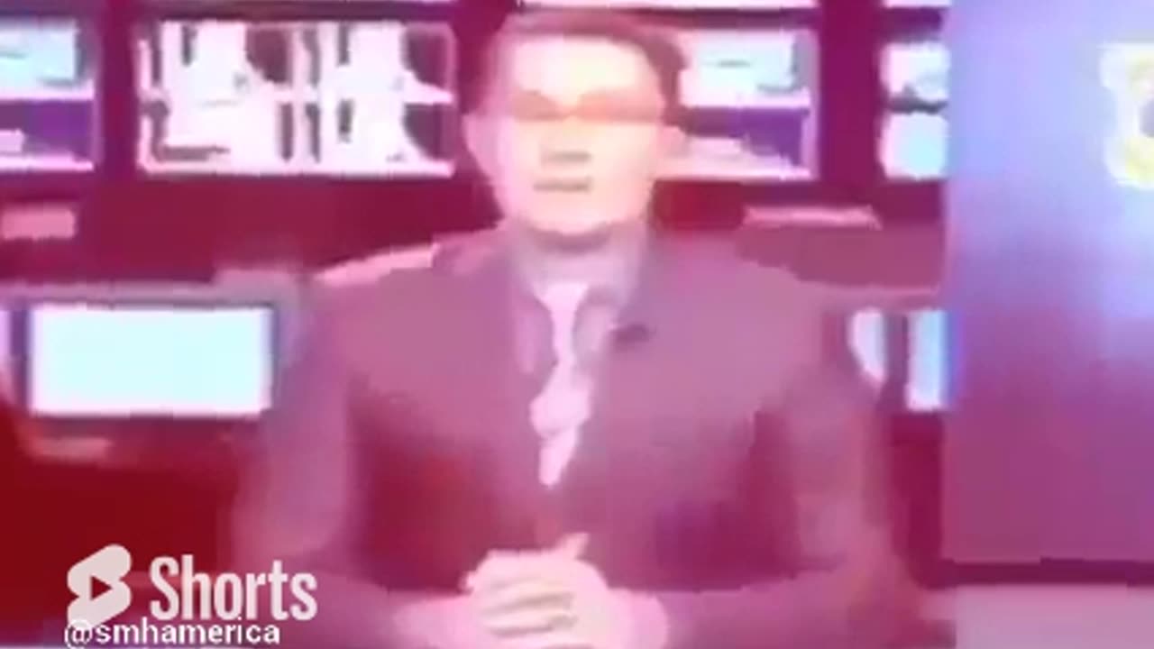 Caught Him Slipping_ News Anchor Caught with his Hand under the Desk