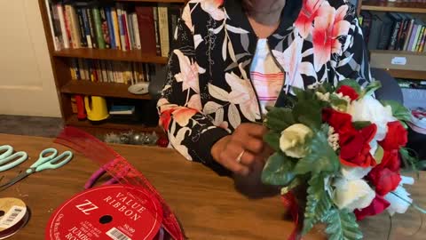 Creating centerpieces out of leftover ornaments pine and baskets