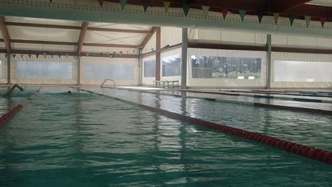 Man Swimming In a Swimming Pool