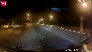 Driver Narrowly Dodges Debris Strewn Across Highway