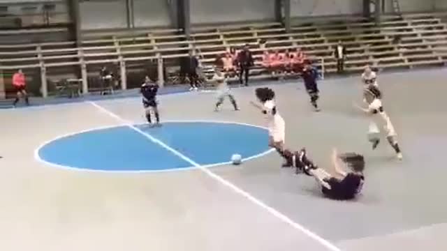a cute woman playing futsal