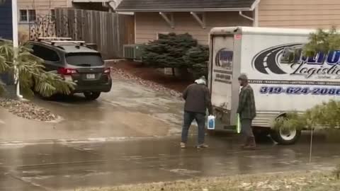 Determined Delivery Drivers Slide Package to Destination