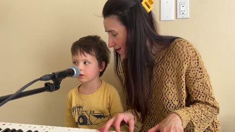 3 years old is improvising on piano and singing