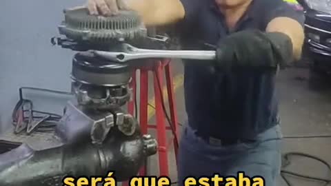 The mechanic removes the mechanical parts