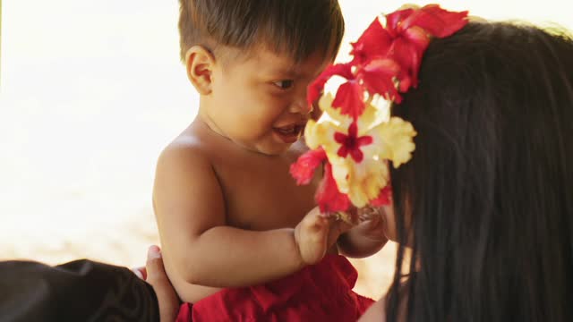 Mother and her cute son playing