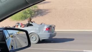 Half a Car Drives down Highway