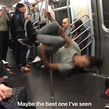 Guy grey dancing spinning subway pole