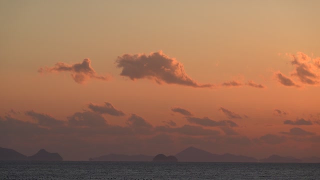 Clouds and seas above the red sky