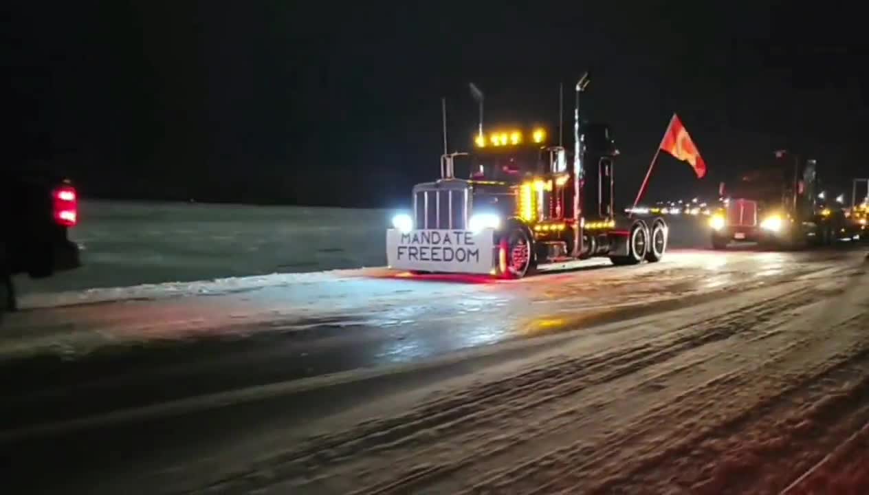 Canadian truckers against Covid mandates block all lanes of traffic to and from the United States.