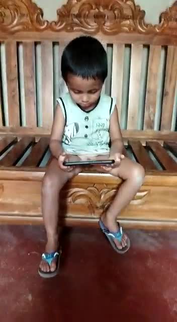 Mobile crazy kids. Naughty baby show kids toy on mobile. Toy freaks baby