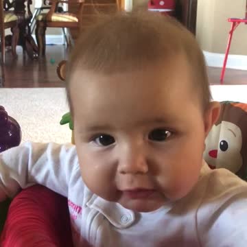 Teething Baby Goes To Town On Jumper