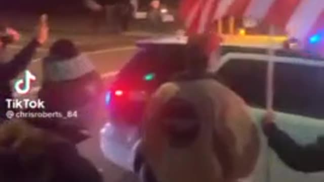 Proud American Law Enforcement Says "Let's Go Brandon" as He Drives By Trump Crowd