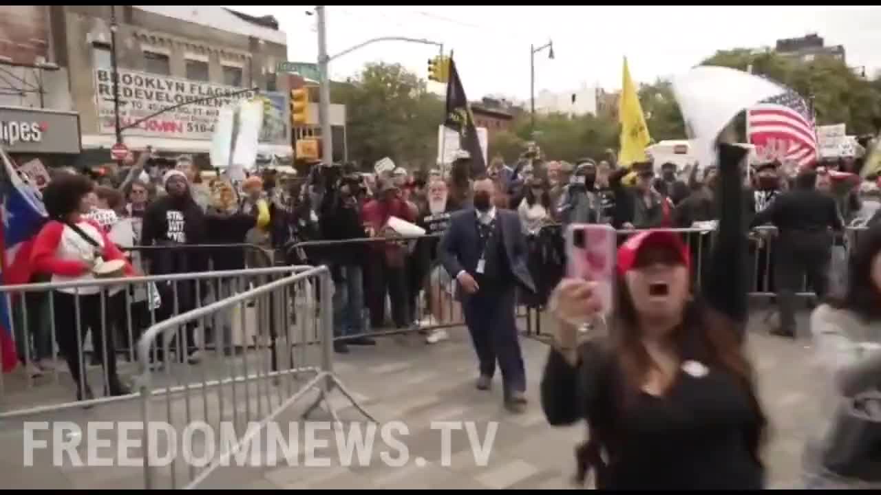 Protesters against vaccine mandates breaking through barricades to Barclay's Center in NYC