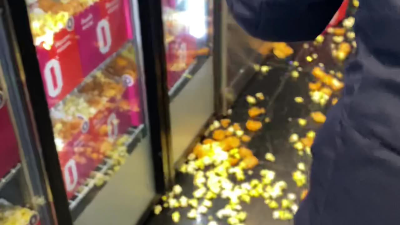 Swinging Door Spills Popcorn