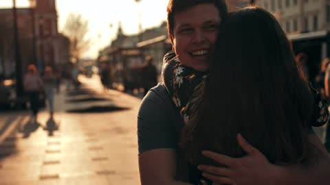 Joyful lovers hugging