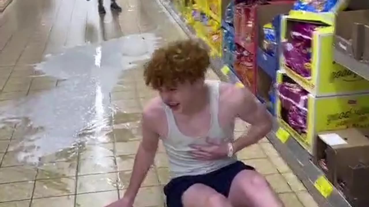 Funny video boy throws the milk in a store and falls back