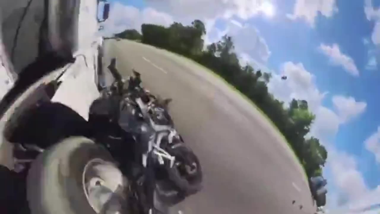 DUDE ON A MOTORCYCLE LANE SPLITS AND CAUSES AN ACCIDENT THEN GETS HIT BY A TRUCK