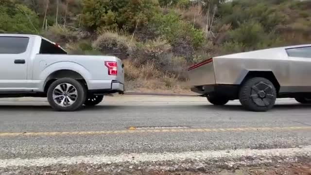 Cybertruck pulls F-150 uphill